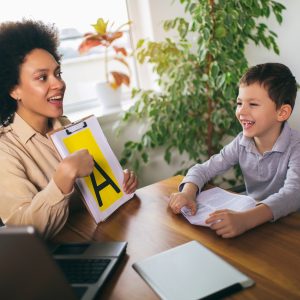 Speech therapist working with a child during special education support session