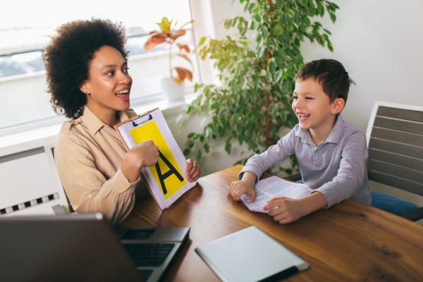Speech therapist working with a child during special education support session